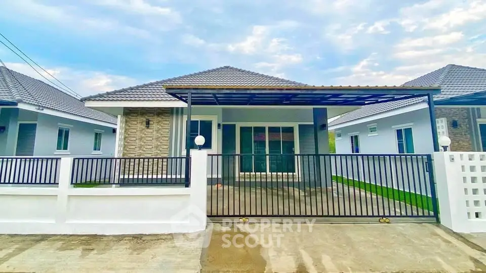 Charming single-story house with modern design and spacious driveway