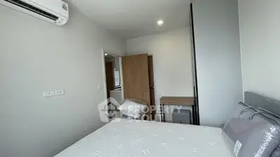 Modern bedroom with air conditioning and minimalist decor in a stylish apartment.