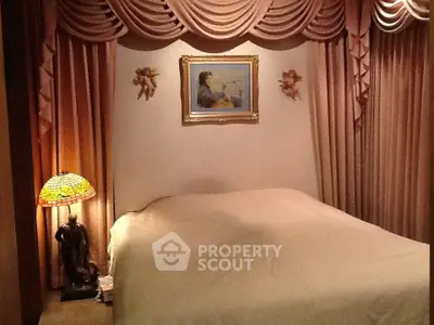 Elegant bedroom with classic drapery and vintage decor