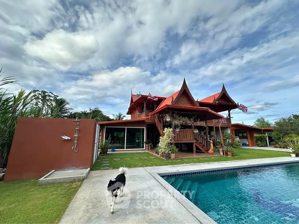 Stunning traditional Thai-style villa with pool and lush garden, perfect for luxury living.