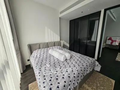 Modern bedroom with stylish decor and ample natural light