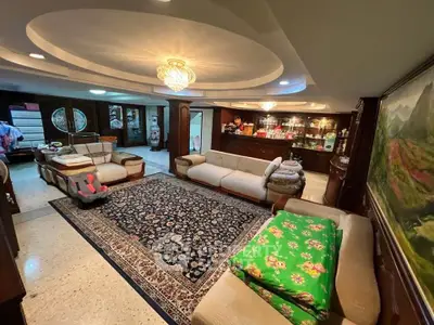 Luxurious living room with elegant lighting and spacious seating area