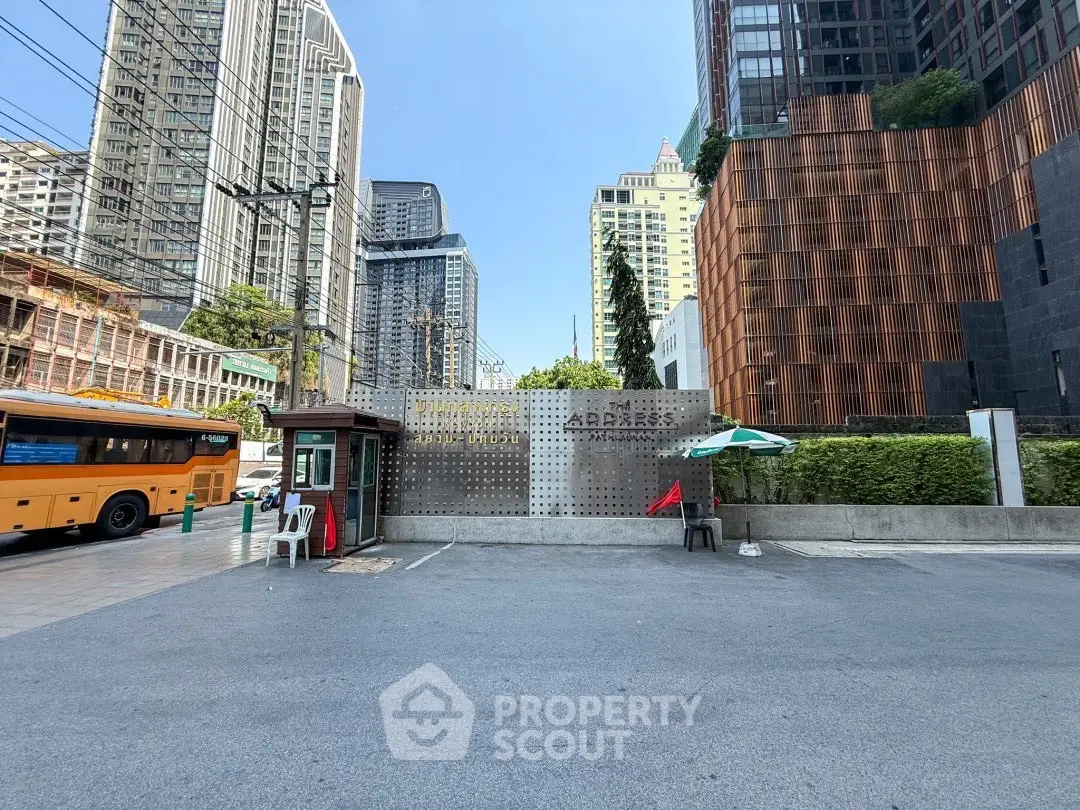 Modern urban building entrance with city skyline backdrop