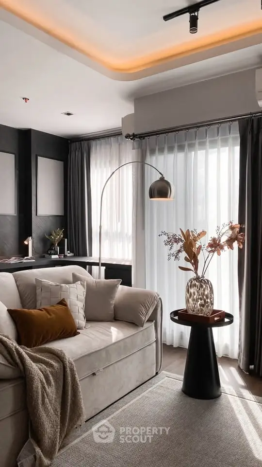 Elegant living room with modern decor and natural light, featuring a cozy sofa and stylish floor lamp.