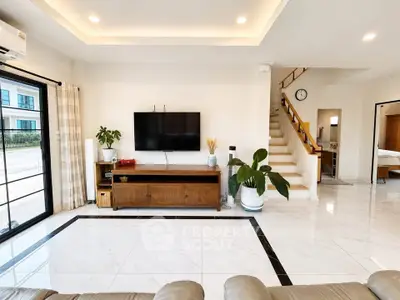 Spacious modern living room with elegant decor and natural light