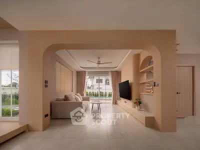 Spacious modern living room with elegant design and large windows offering natural light.