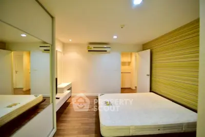 Spacious bedroom with modern design and ample natural light