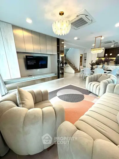Luxurious modern living room with plush sofas and elegant lighting