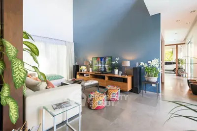 Spacious living room with modern decor and natural light