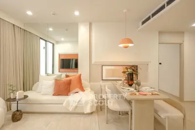 Modern living room with stylish decor and dining area in open layout apartment.