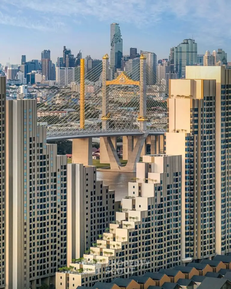 Stunning cityscape view with modern high-rise buildings and iconic bridge in the background.