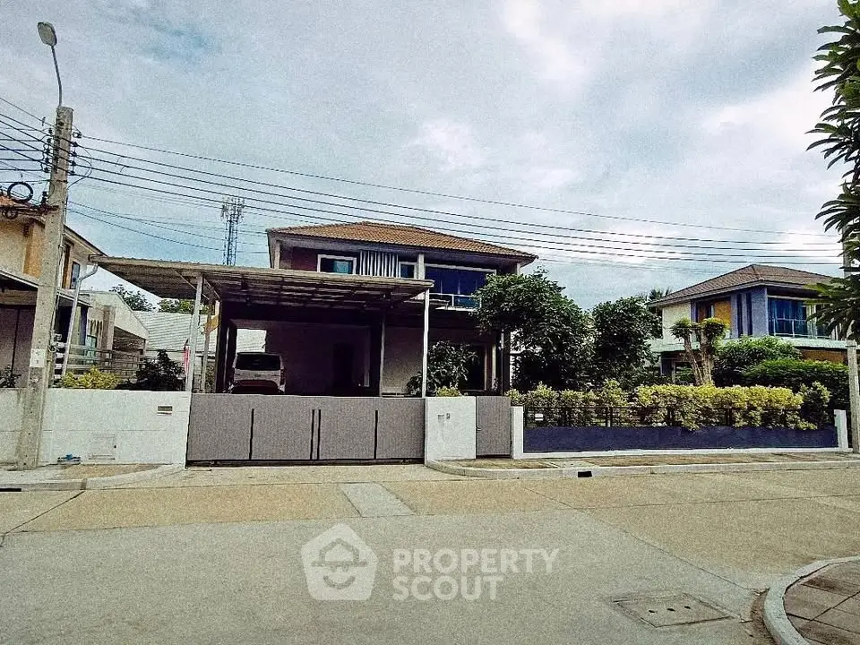 Charming suburban house with modern design and lush greenery, perfect for family living.