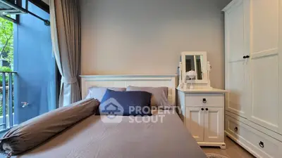 Cozy bedroom with elegant white furniture and large window view