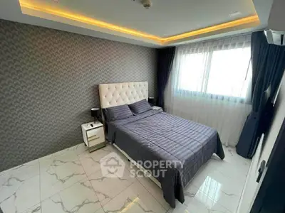 Luxurious bedroom with modern design and elegant lighting in a stylish apartment.