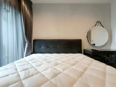 Modern bedroom with stylish decor and large comfortable bed