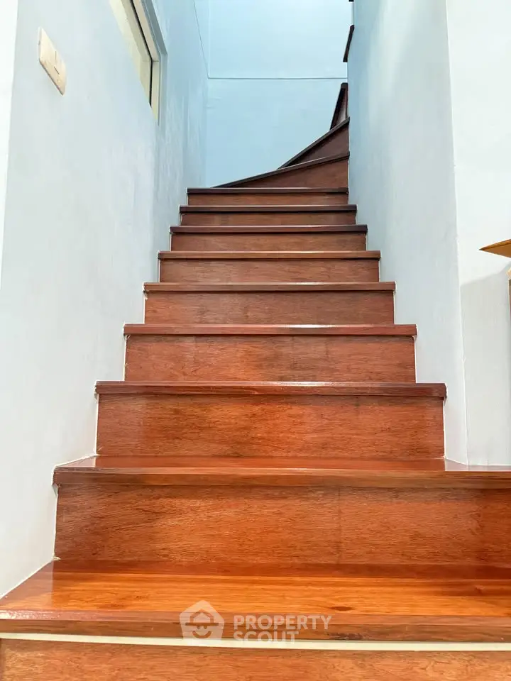 Elegant wooden staircase with polished finish in a modern home interior