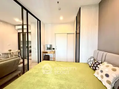 Modern bedroom with stylish decor and open layout in a contemporary apartment.