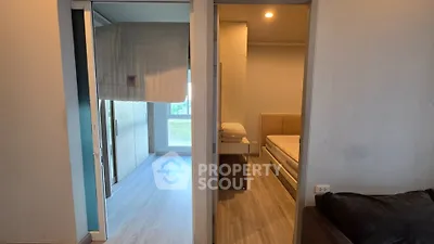 Modern apartment interior with two bedrooms featuring sleek design and natural light.