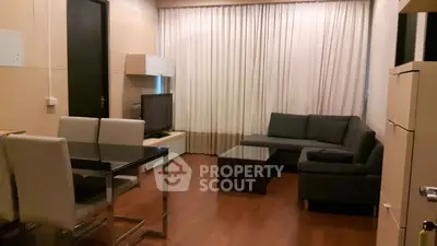 Modern living room with sleek furniture and wooden flooring