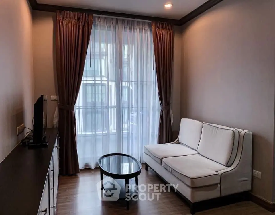 Cozy living room with elegant curtains and modern furniture in a stylish apartment.