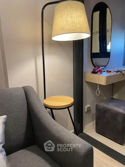 Cozy living room corner with modern lamp and stylish decor