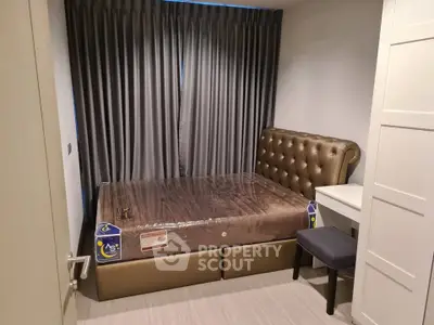 Cozy bedroom with elegant tufted headboard and modern furnishings, perfect for restful nights.