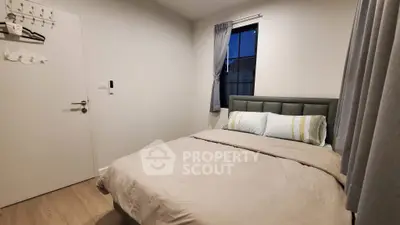 Cozy bedroom with modern decor and natural light