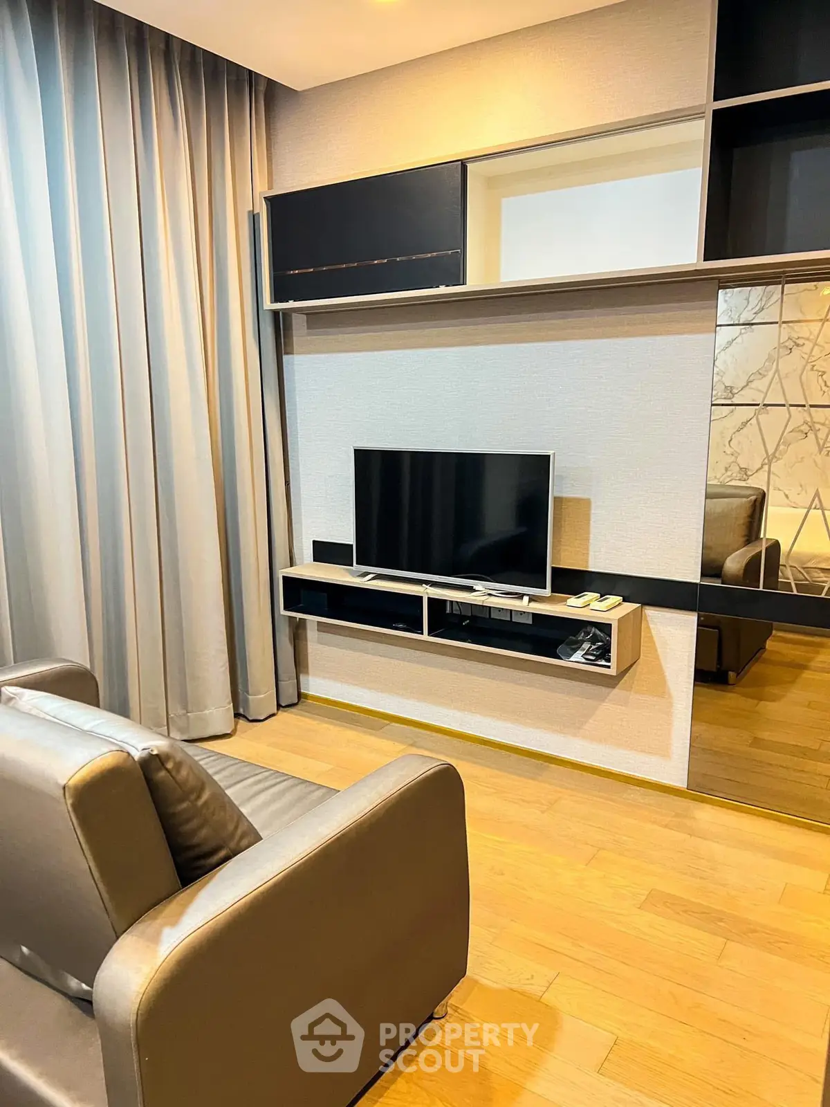 Modern living room with sleek TV setup and stylish furniture