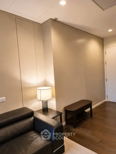 Modern living room with sleek leather sofa and ambient lighting