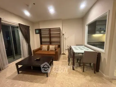 Modern living room with elegant furniture and open kitchen view, perfect for urban living.