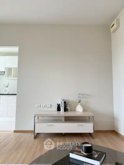 Modern minimalist living room with sleek furniture and neutral tones