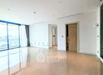 Spacious modern living room with city view and large windows