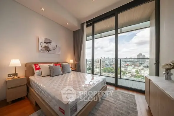 Luxurious bedroom with city view and large balcony access