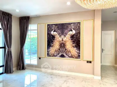 Luxurious living room with elegant decor and large window view