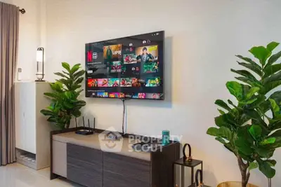 Modern living room with wall-mounted TV and stylish decor