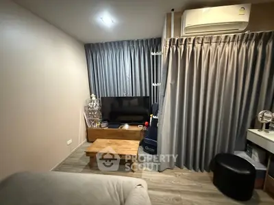 Cozy living room with modern decor and air conditioning