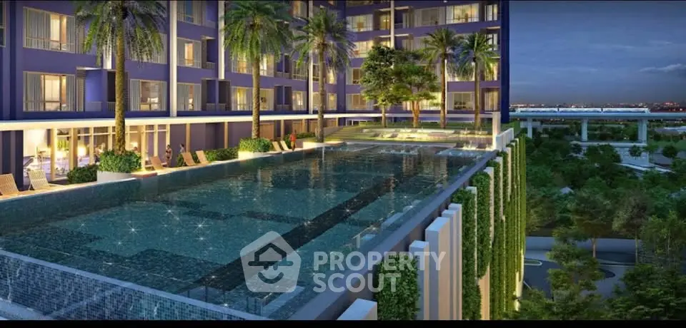 Luxurious apartment complex with stunning pool and lush greenery