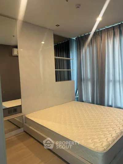 Modern bedroom with stylish design and large windows for natural light