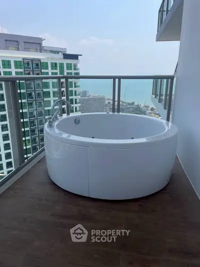Luxurious balcony with a private jacuzzi and stunning city view, perfect for relaxation and entertainment.