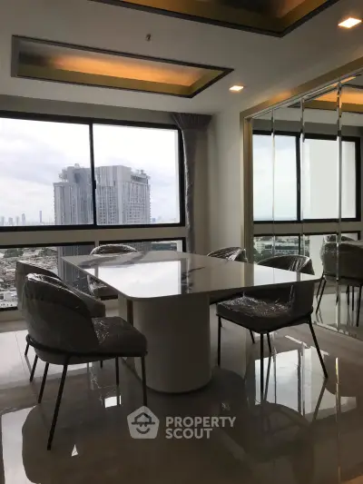 Modern dining area with panoramic city view and elegant furnishings in high-rise apartment.