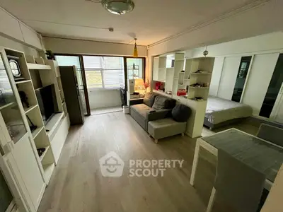 Modern open-plan living room with cozy seating and stylish decor