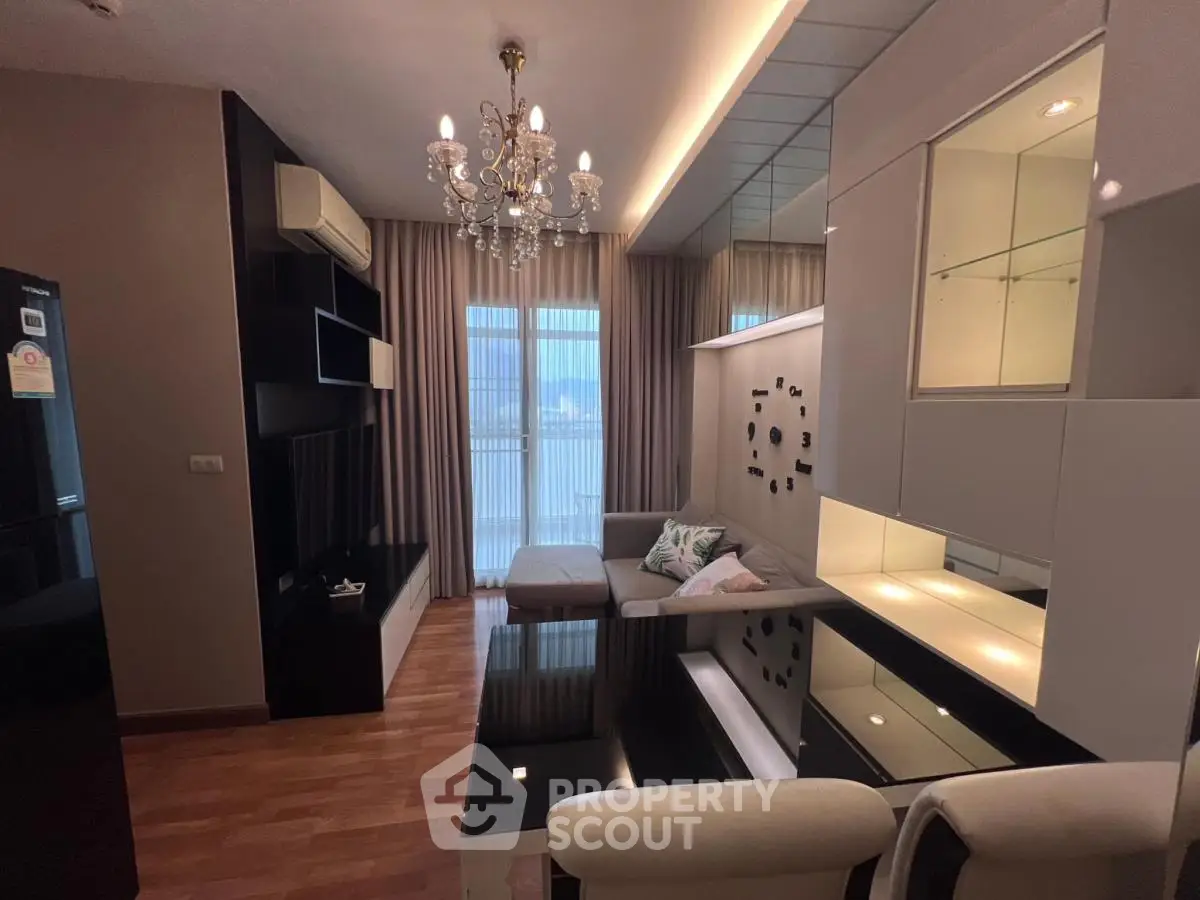 Luxurious living room with modern decor and chandelier lighting