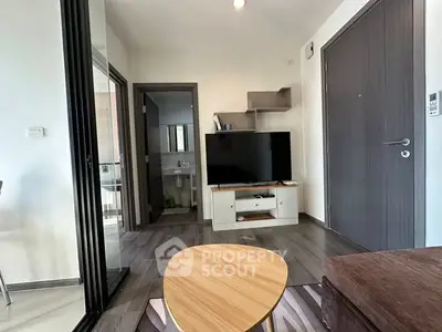 Modern living room with sleek TV setup and stylish wooden furniture