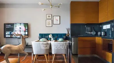 Modern living room with stylish dining area and open kitchen layout