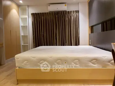 Spacious bedroom with modern design and ample storage space