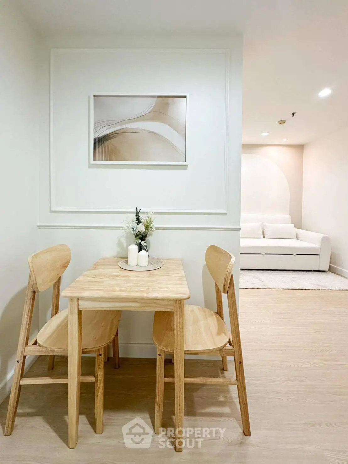 Cozy dining area with wooden table and chairs in modern apartment