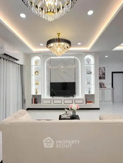 Luxurious living room with elegant chandeliers and modern decor