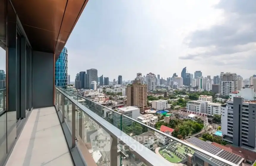 Stunning cityscape view from a high-rise balcony in a modern urban apartment.