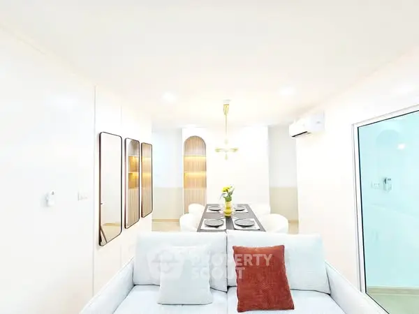 Modern living room with elegant dining area and stylish decor