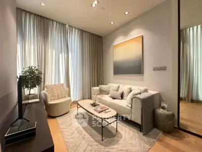 Elegant living room with modern decor and cozy seating area, perfect for relaxation.